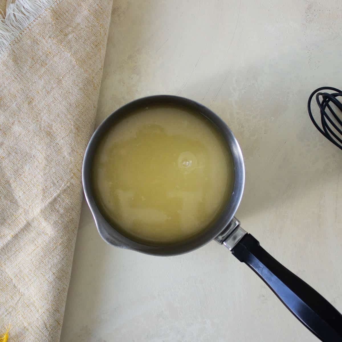 Lemon glaze in a small saucepan.