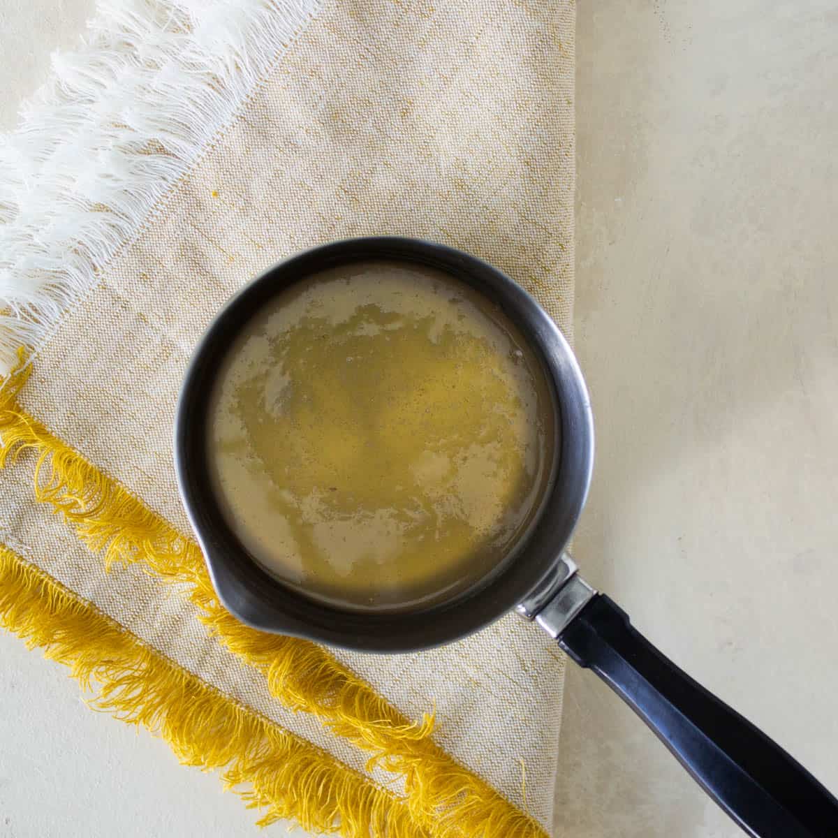 Lemon juice and sugar syrup in a small saucepan.