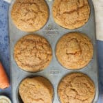 Top view of baked muffins in a muffin tin.