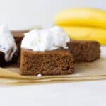 A banana bar with a scoop of white ice cream on top.