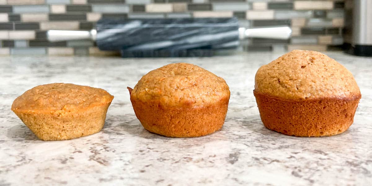 3 muffins in a row showing the testing process, from flat and dense to tall and majestic.