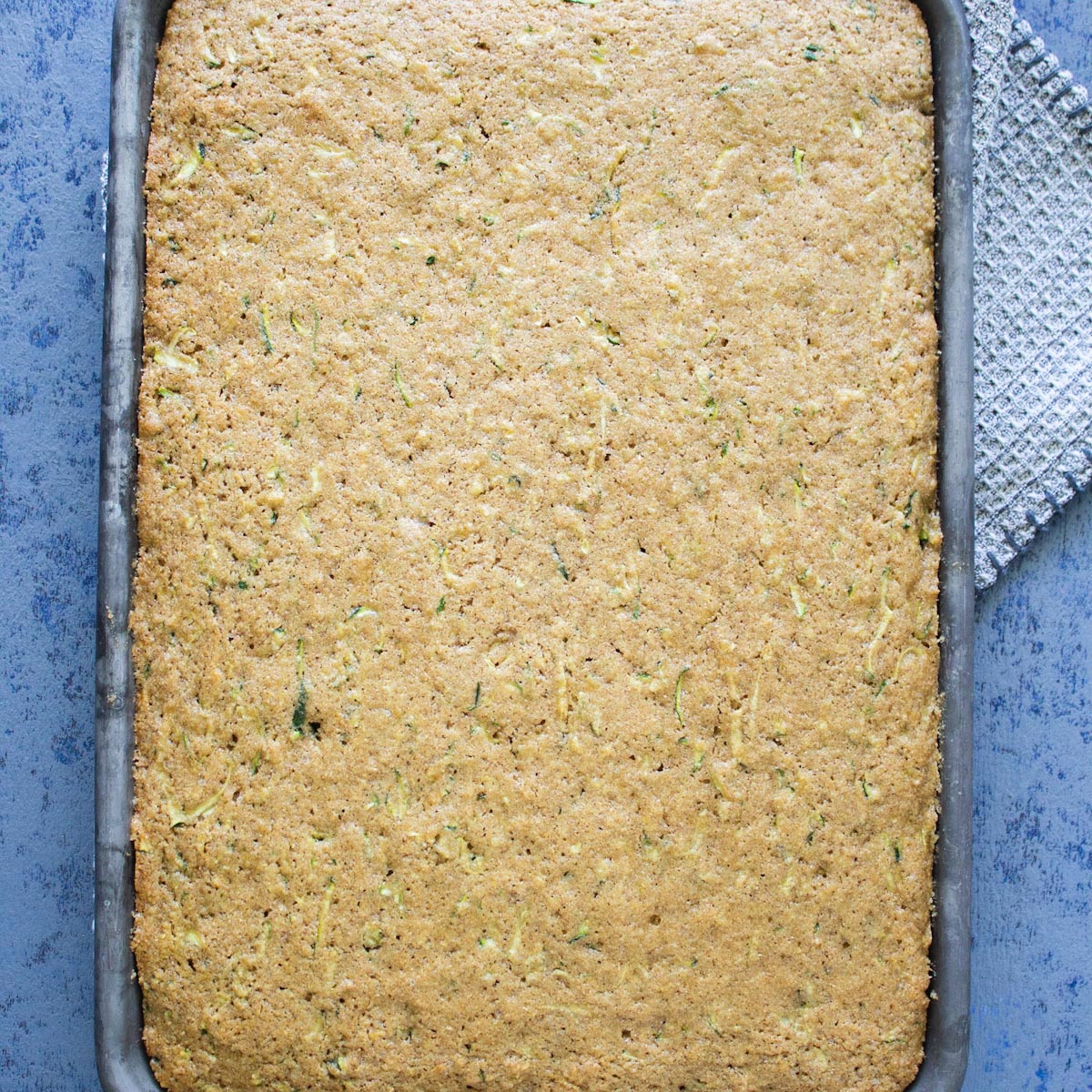 Top view of a baked zucchini sheet cake