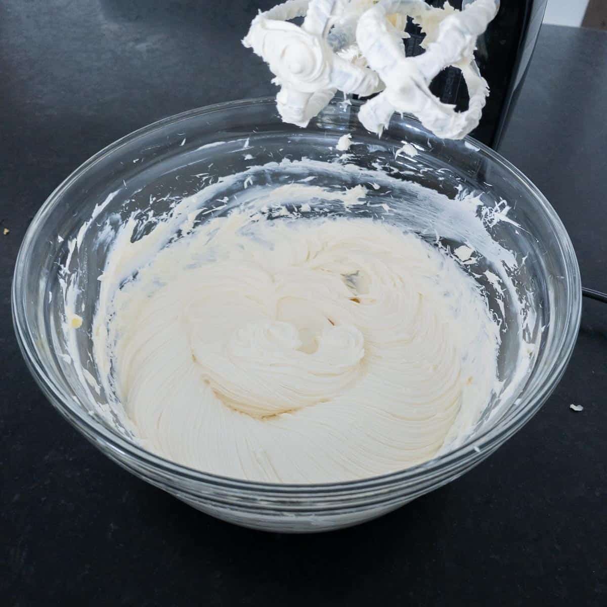 Cream cheese and butter whipped together in a bowl.