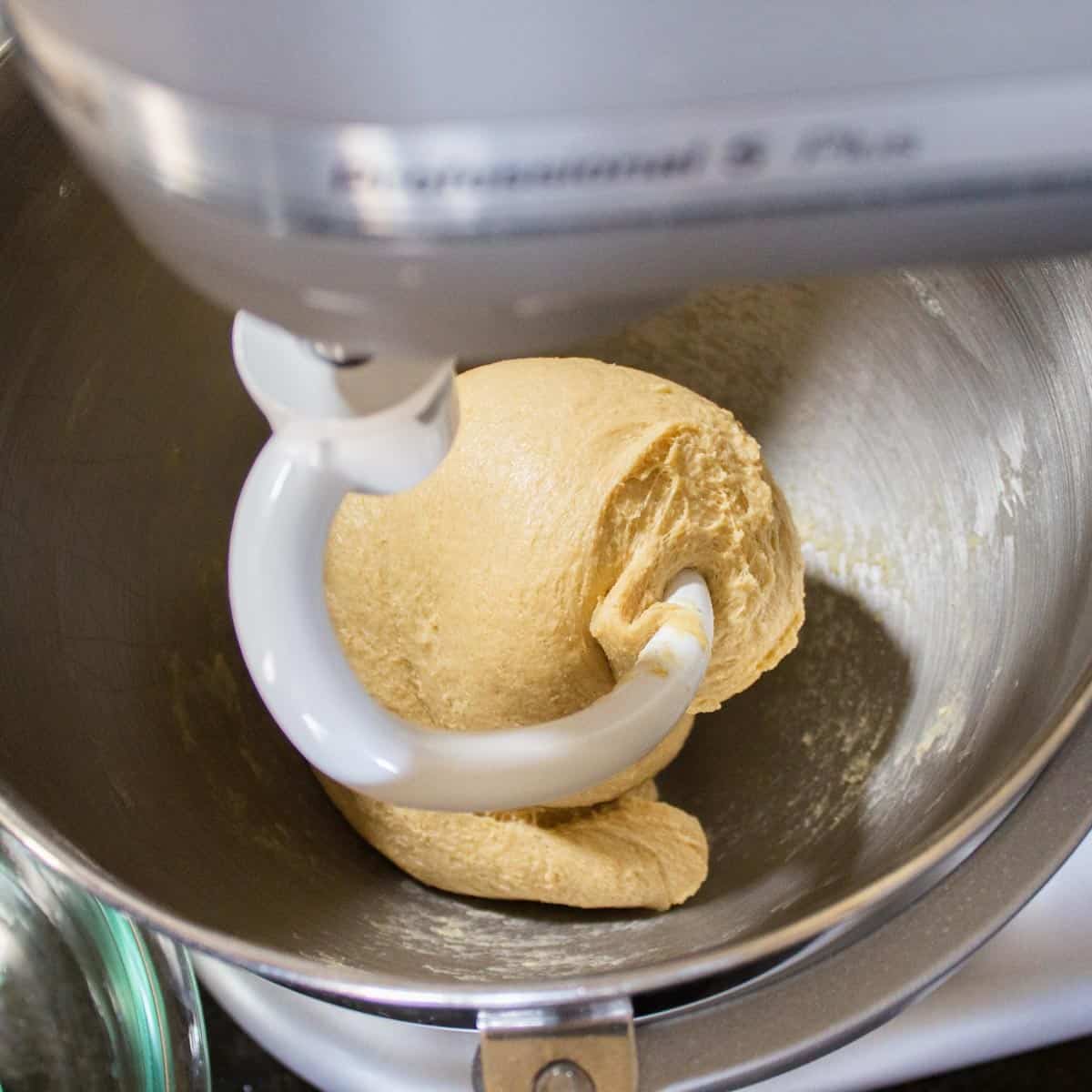 Kneaded dough in the bowl of a stand mixer.