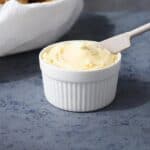 Homemade honey butter in a white ramekin.