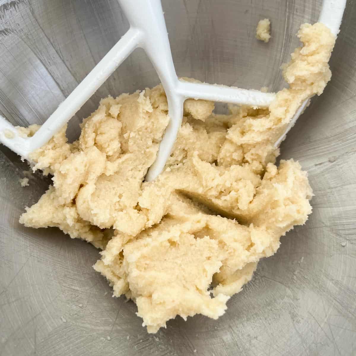 Butter and sugar creamed together in a bowl.