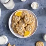 A plate of mini coconut orange white chocolate chip cookkies.