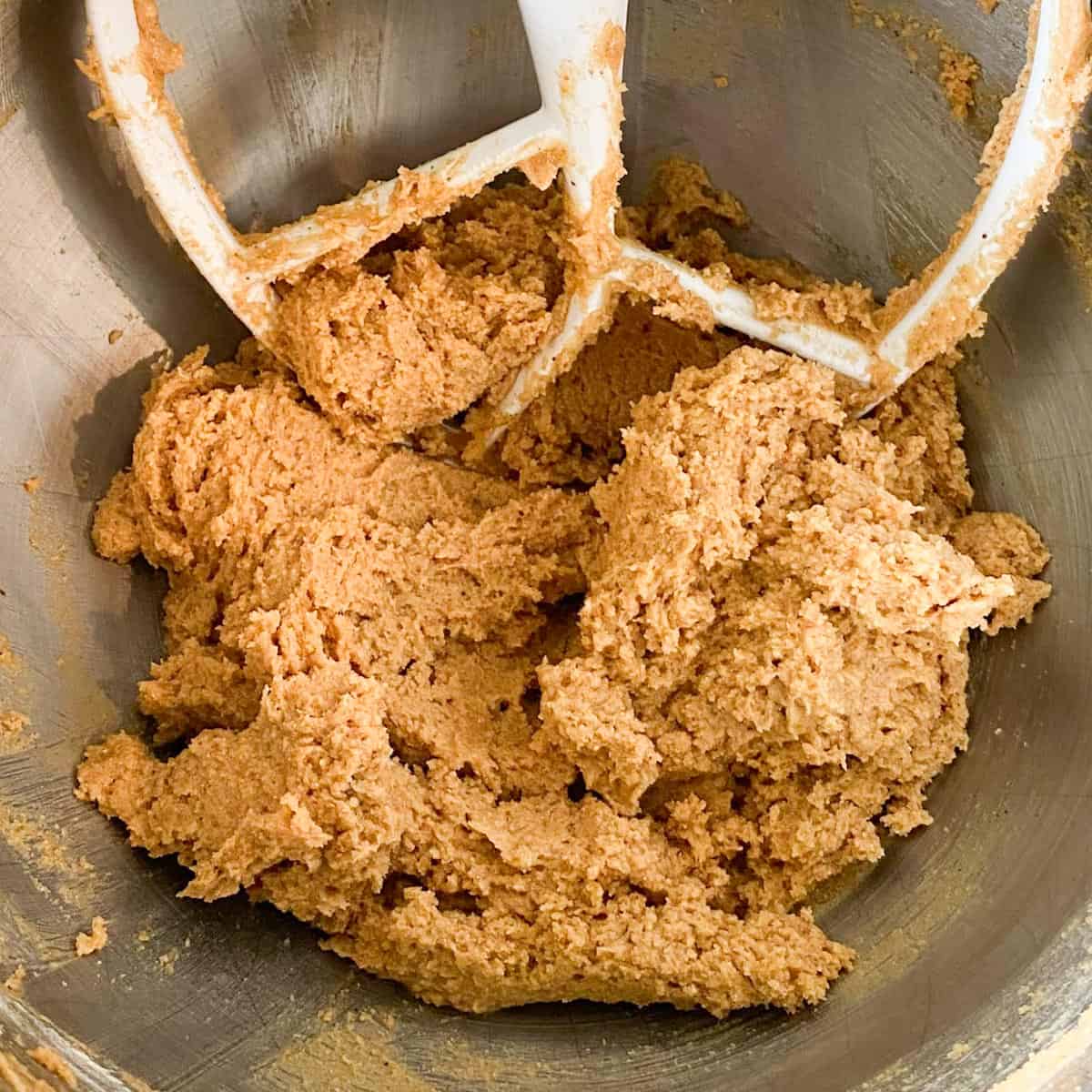 Whole wheat peanut butter cookie dough in a bowl.