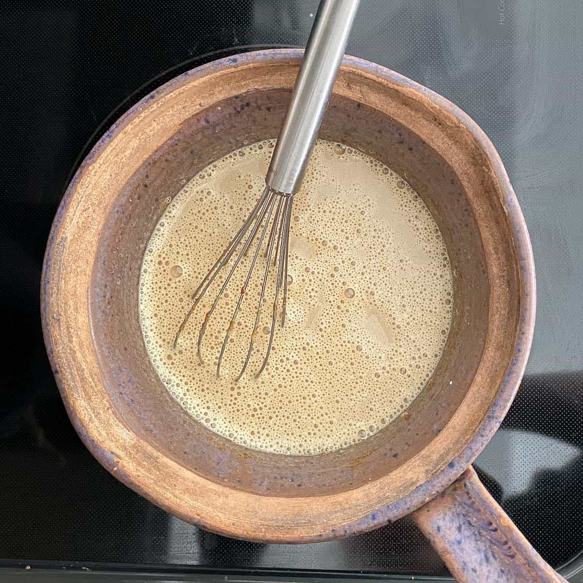 Half and half stirred into sugar and egg yolks.