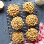 Whole wheat apple streusel muffins on a cooling rack.