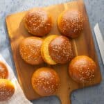 Whole wheat sweet potato buns on a wooden board.